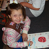 Brownie drawing a ladybug